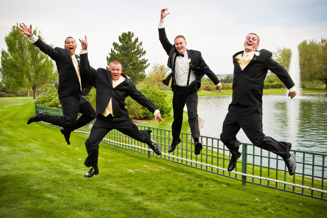 Groomsmen jumping at wedding