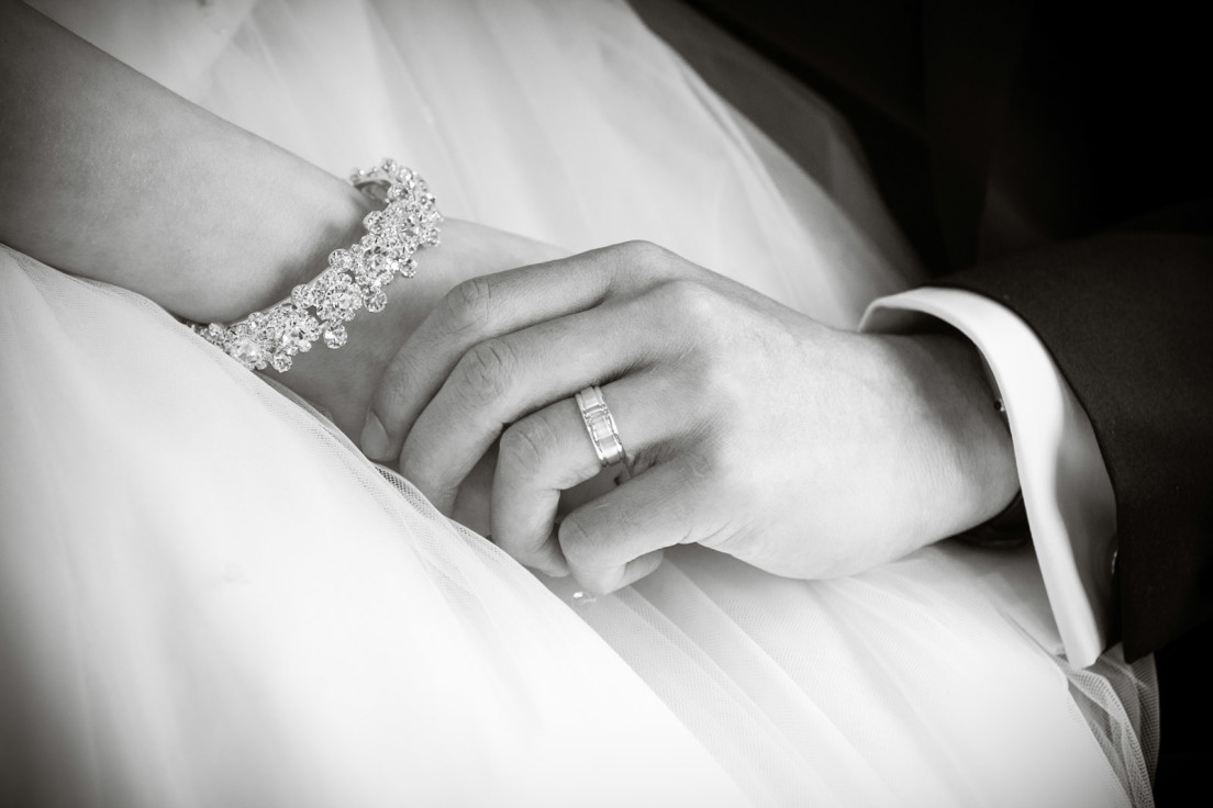 Wedding photograph of hands and rings